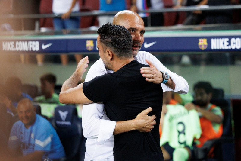 Xavi Hernandez of FC Barcelona and Pep Guardiola of Manchester City during the benefic friendly match to raise funds for ELA between FC Barcelona and Manchester City at Spotify Camp Nou in Barcelona, Spain.