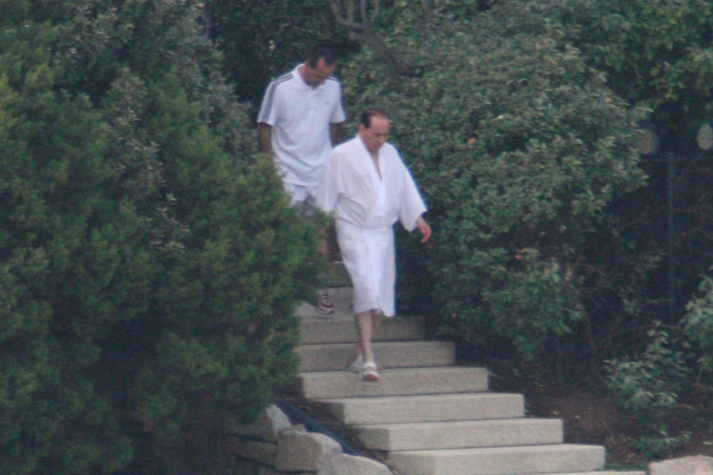 silvio berlusconi on bathrobe