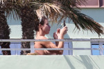 *PREMIUM-EXCLUSIVE* *Warning Contains nudity* Elisabetta Canalis and Georgian Cimpeanu Enjoy Nude Sunbathing Before Lunch in Miami Beach