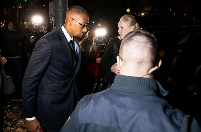 Munich, Germany. 02nd Nov, 2022. Professional soccer player and former national team player Jerome Boateng (l) leaves the Munich I Regional Court after the verdict in the appeal trial. The Regional Court convicted Boateng of assault in his appeal trial. I