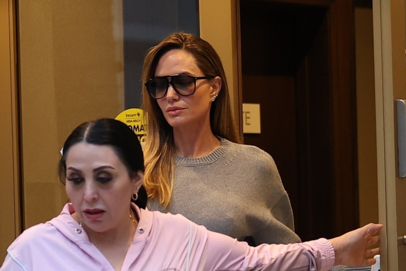 *EXCLUSIVE* Busy Angelina Jolie stops to visit a friend's apartment in LA
