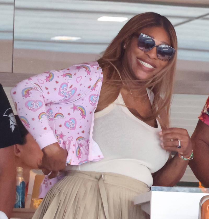 MIAMI GARDENS, FLORIDA - MARCH 29: Serena Williams tries on daughters extra small Barbi Jacket in VIP suite with Demarri
