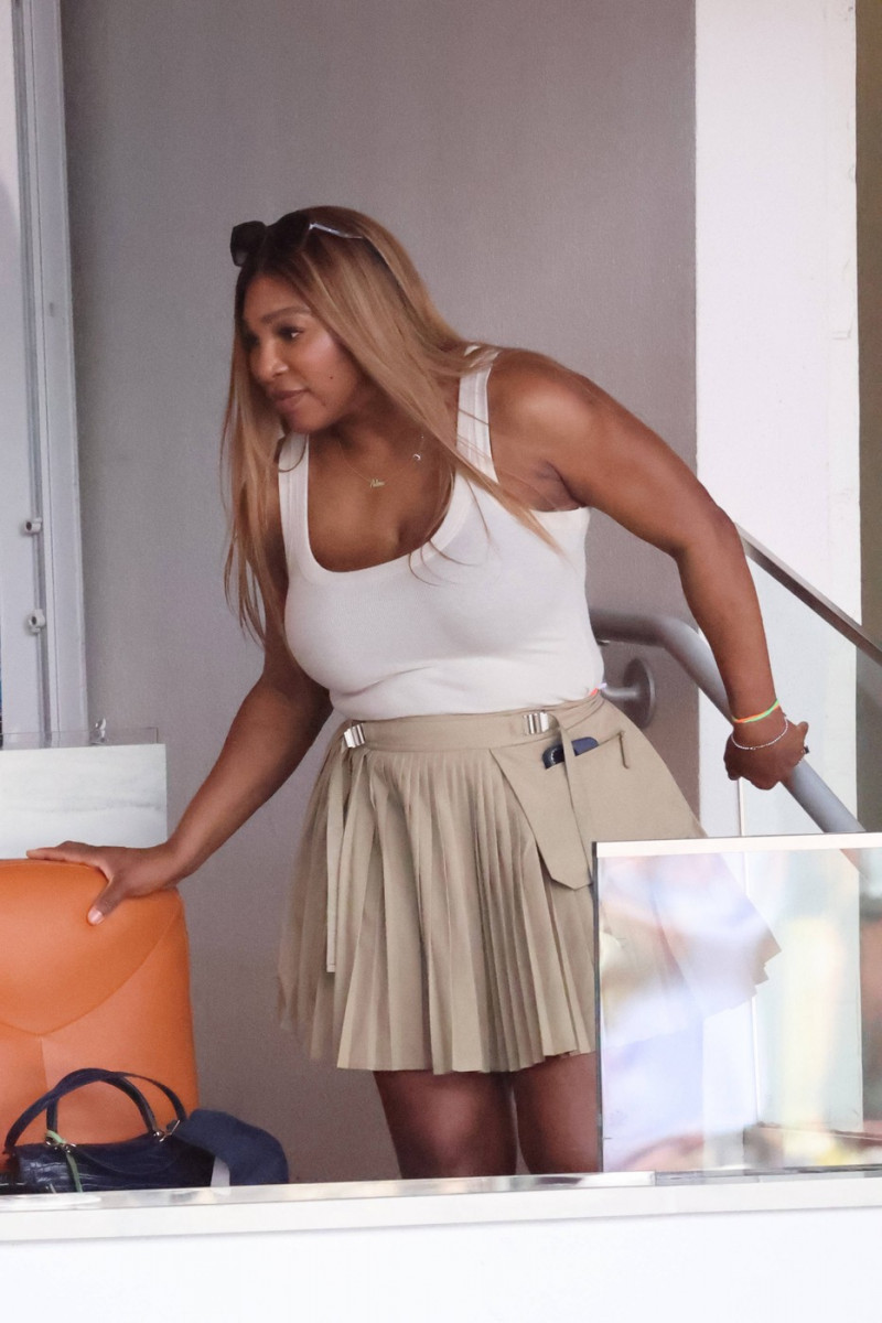 MIAMI GARDENS, FLORIDA - MARCH 29: Serena Williams tries on daughters extra small Barbi Jacket in VIP suite with Demarri