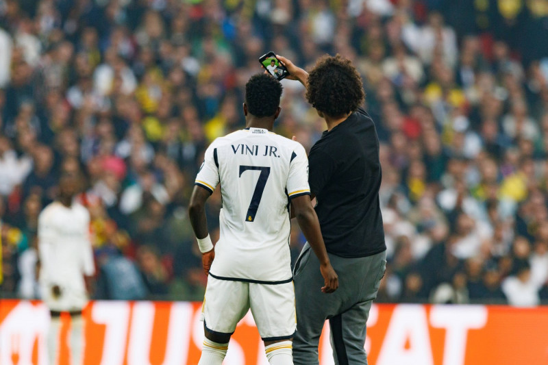 Vinicius Junior with a pitch invader during during Champions League 2024 final game between Borussia Dortmund and Real M