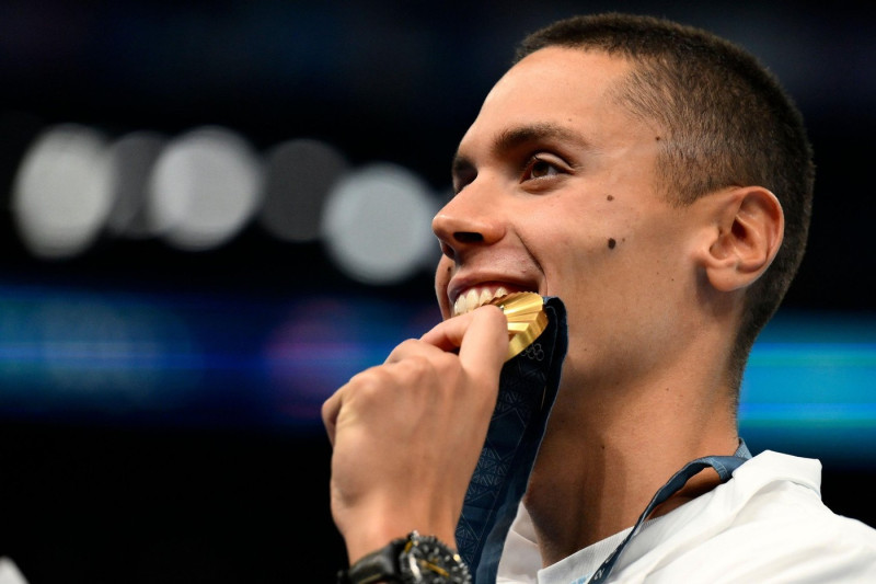 David Popovici of Romania attends the medal ceremony of the 200m Freestyle Men Final during the Paris 2024 Olympic Games at La Defense Arena in Paris (France), July 29, 2024. David Popovici placed first winning the gold medal.