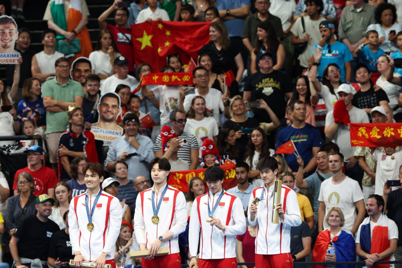 NANTERRE, FRANCE - AUGUST 04: (L-R) Gold medallists Xu Jiayu, Qin Haiyang, Sun Jiajun and Pan Zhanle of Team China pose