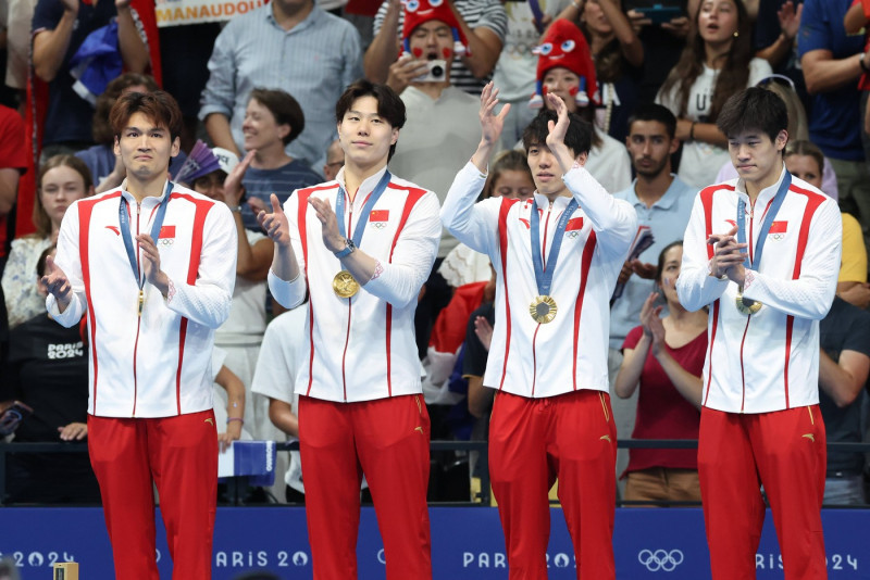 NANTERRE, FRANCE - AUGUST 04: (L-R) Gold medallists Xu Jiayu, Qin Haiyang, Sun Jiajun and Pan Zhanle of Team China pose