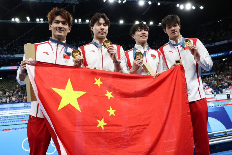 NANTERRE, FRANCE - AUGUST 04: (L-R) Gold medallists Xu Jiayu, Qin Haiyang, Sun Jiajun and Pan Zhanle of Team China pose