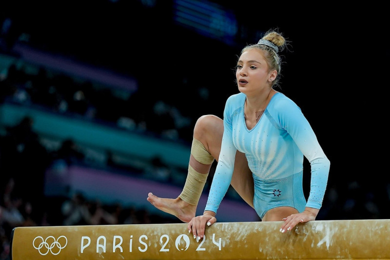 PARIS, FRANCE - AUGUST 5: Sabrina Maneca-Voinea of Romania falls down during the Women's Balance Beam Final on day ten of the Olympic Games Paris 2024 at Bercy Arena on August 5, 2024 in Paris, France. (Daniela Porcelli / SPP)