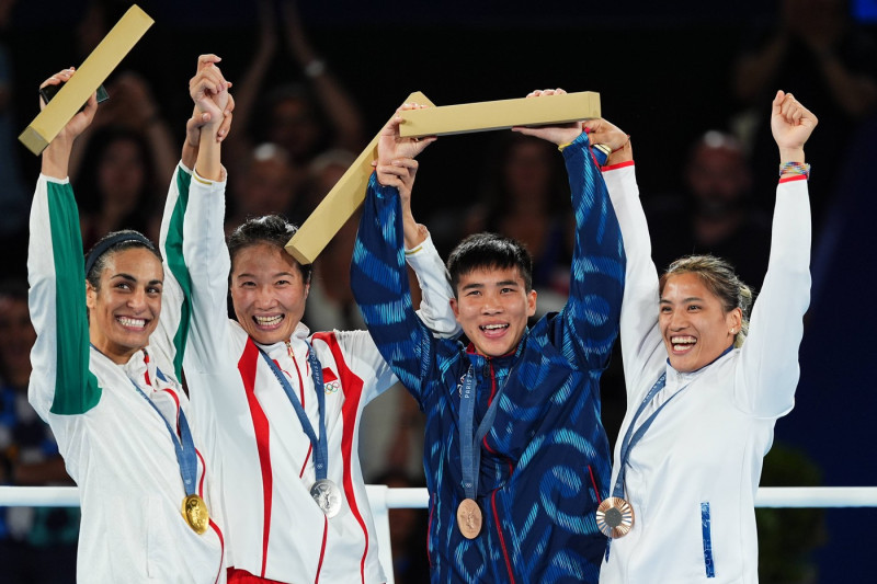 PARIS, FRANCE - AUGUST 09: (L-R) Gold medalist Imane Khelif of Team Algeria, silver medalist Yang Liu of Team China and