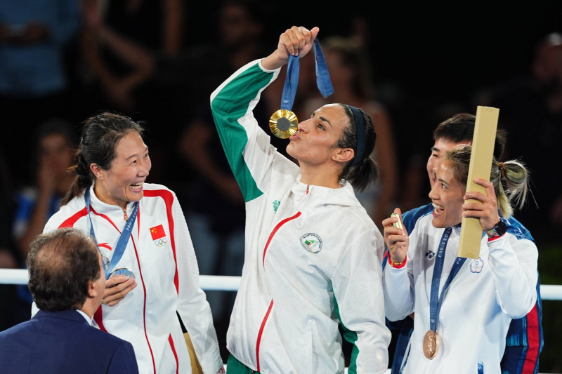 PARIS, FRANCE - AUGUST 09: Gold medalist Imane Khelif (L2) of Team Algeria poses during the victory ceremony for the Box