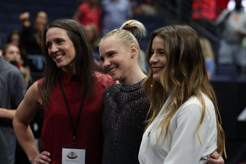 August 19, 2022: Jade Carey (Oregon State University) poses with Chellsie Memmel (USA Gymnastics' Technical Lead) and Alicia Sacramone Quinn (USA Gymnastics' Strategic Lead) after the senior women's preliminaries at the 2022 U.S. Gymnastics Championship.