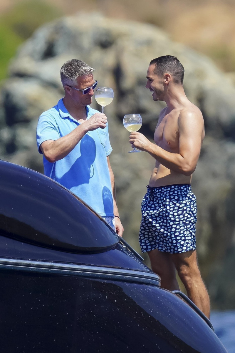 *EXCLUSIVE* *WEB MUST CALL FOR PRICING* German former racing driver Ralf Schumacher and his partner Etienne enjoy a few tender moments aboard a yacht on a day out at sea in St. Tropez