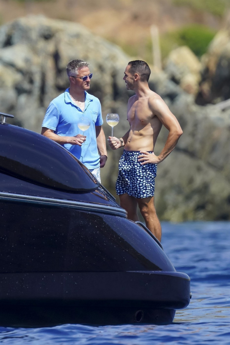 *EXCLUSIVE* *WEB MUST CALL FOR PRICING* German former racing driver Ralf Schumacher and his partner Etienne enjoy a few tender moments aboard a yacht on a day out at sea in St. Tropez