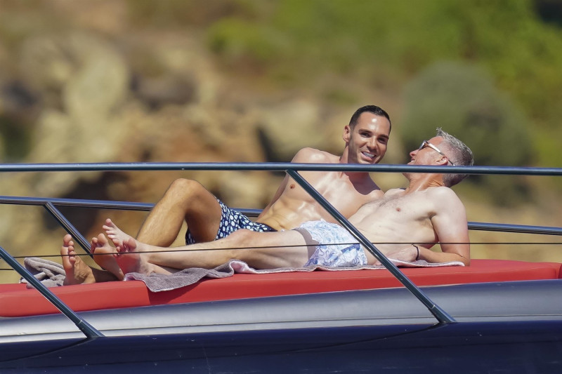 *EXCLUSIVE* *WEB MUST CALL FOR PRICING* German former racing driver Ralf Schumacher and his partner Etienne enjoy a few tender moments aboard a yacht on a day out at sea in St. Tropez