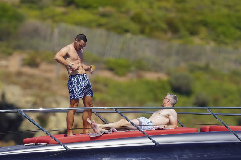 *EXCLUSIVE* *WEB MUST CALL FOR PRICING* German former racing driver Ralf Schumacher and his partner Etienne enjoy a few tender moments aboard a yacht on a day out at sea in St. Tropez