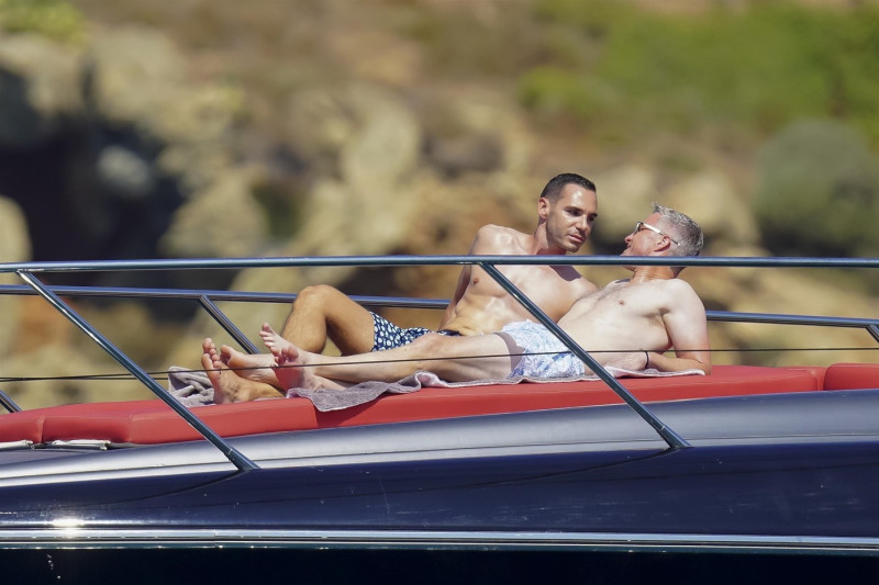 *EXCLUSIVE* *WEB MUST CALL FOR PRICING* German former racing driver Ralf Schumacher and his partner Etienne enjoy a few tender moments aboard a yacht on a day out at sea in St. Tropez