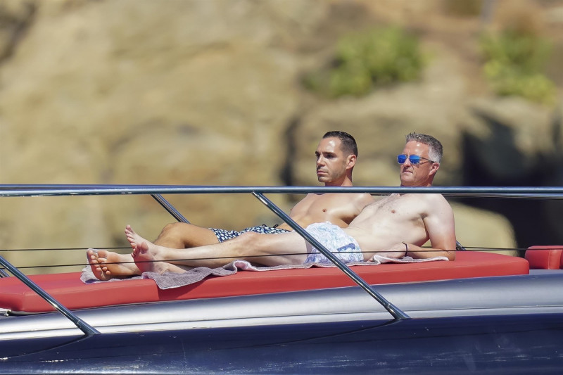 *EXCLUSIVE* *WEB MUST CALL FOR PRICING* German former racing driver Ralf Schumacher and his partner Etienne enjoy a few tender moments aboard a yacht on a day out at sea in St. Tropez