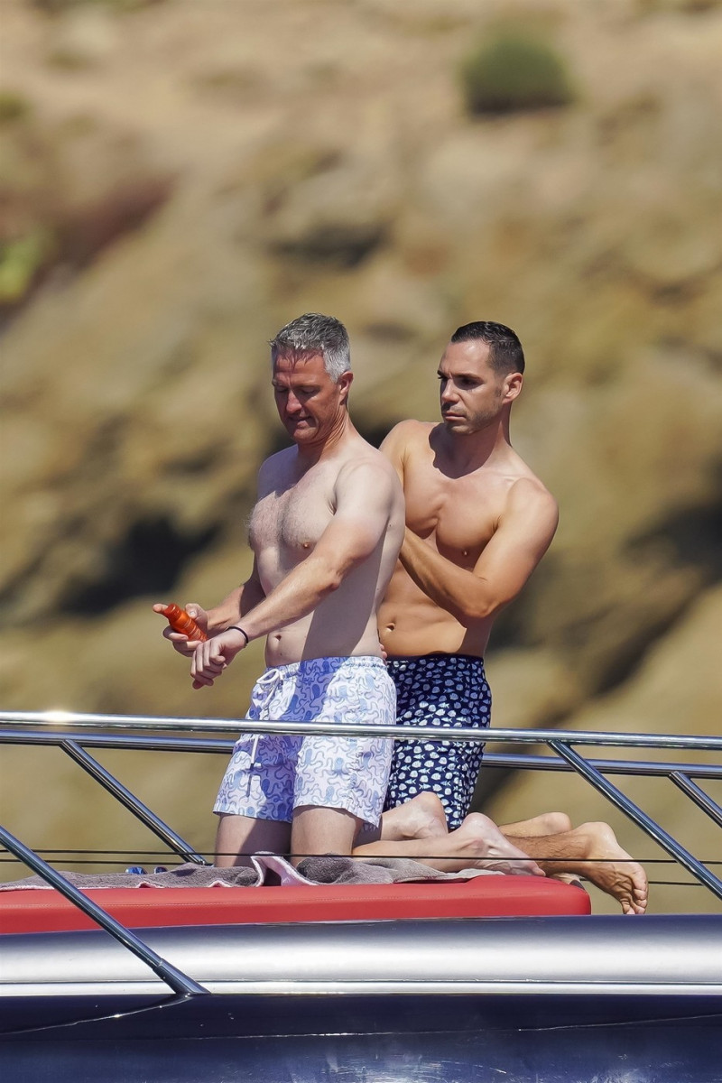 *EXCLUSIVE* *WEB MUST CALL FOR PRICING* German former racing driver Ralf Schumacher and his partner Etienne enjoy a few tender moments aboard a yacht on a day out at sea in St. Tropez