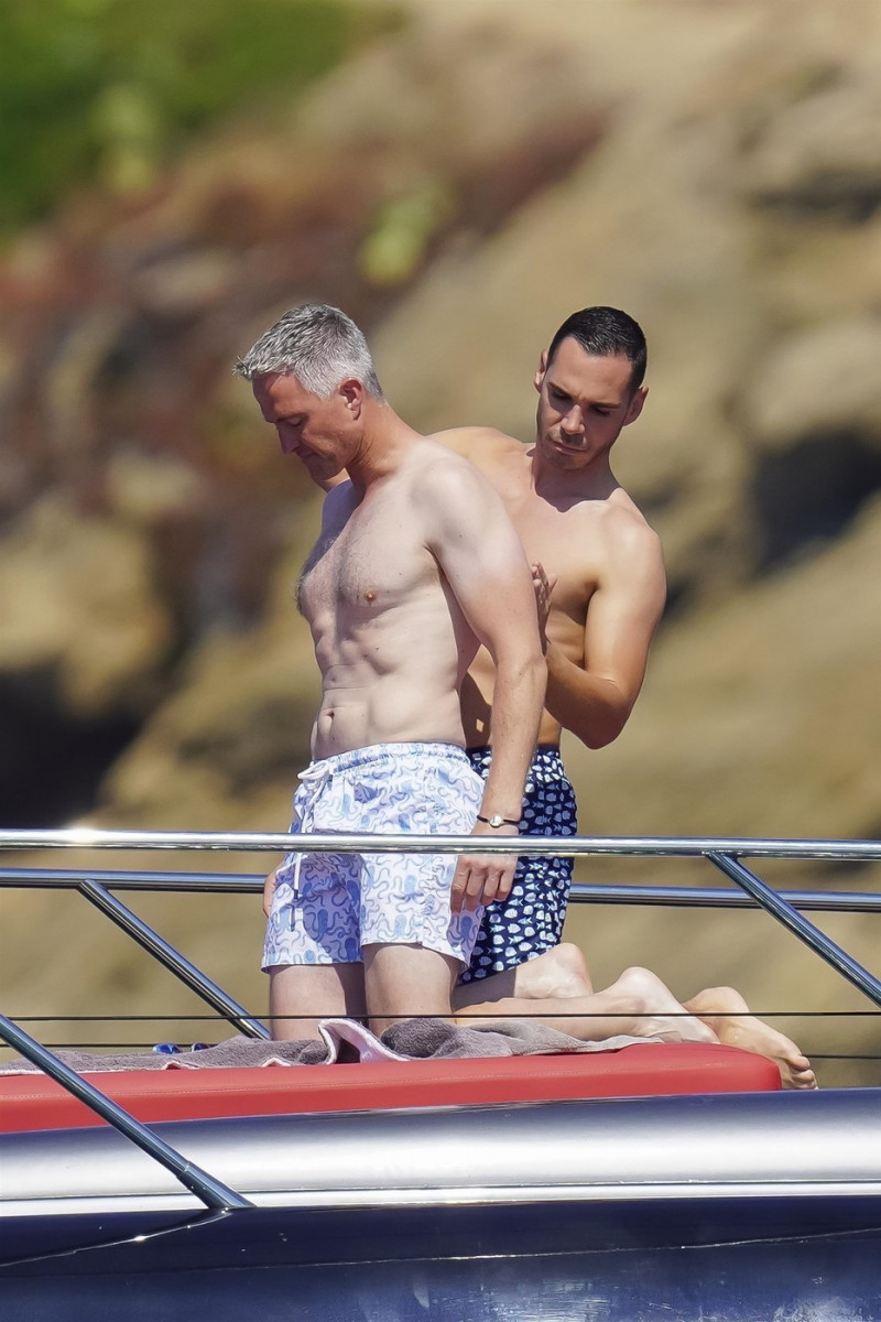 *EXCLUSIVE* *WEB MUST CALL FOR PRICING* German former racing driver Ralf Schumacher and his partner Etienne enjoy a few tender moments aboard a yacht on a day out at sea in St. Tropez