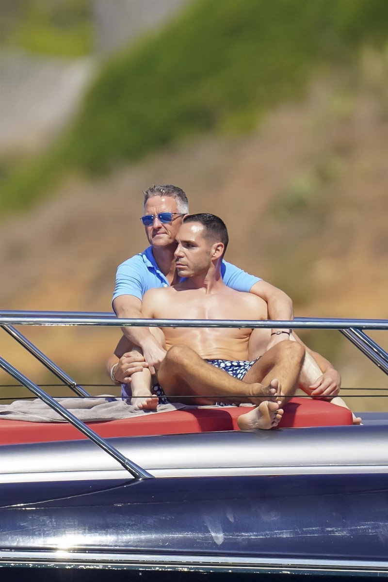 *EXCLUSIVE* *WEB MUST CALL FOR PRICING* German former racing driver Ralf Schumacher and his partner Etienne enjoy a few tender moments aboard a yacht on a day out at sea in St. Tropez