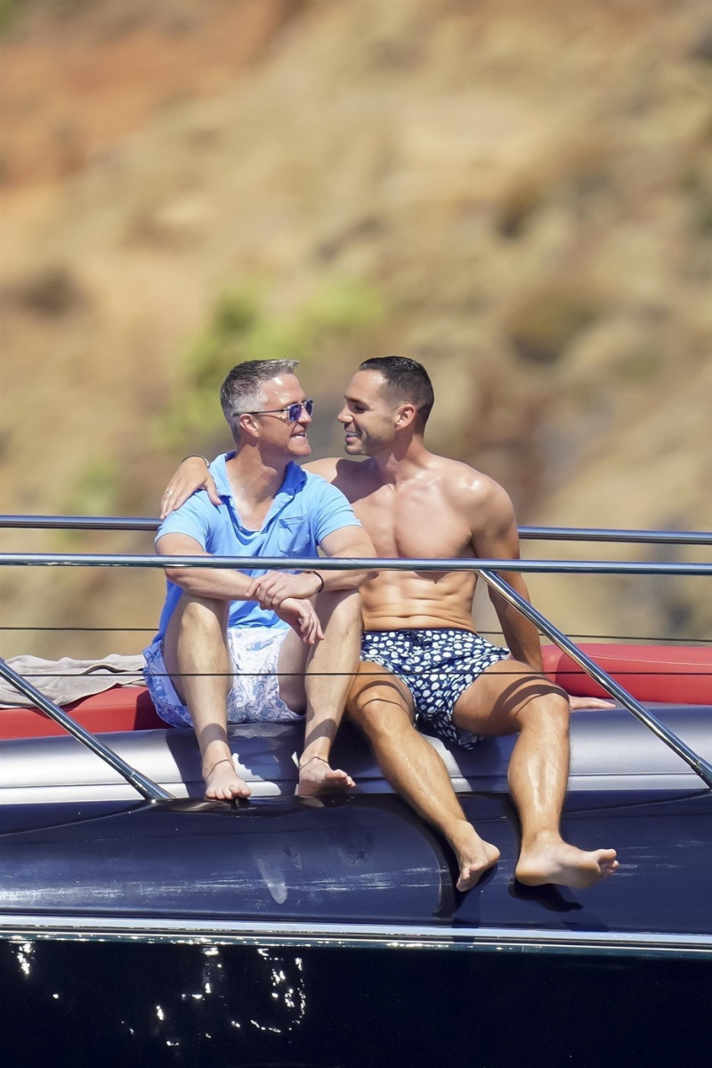 *EXCLUSIVE* *WEB MUST CALL FOR PRICING* German former racing driver Ralf Schumacher and his partner Etienne enjoy a few tender moments aboard a yacht on a day out at sea in St. Tropez