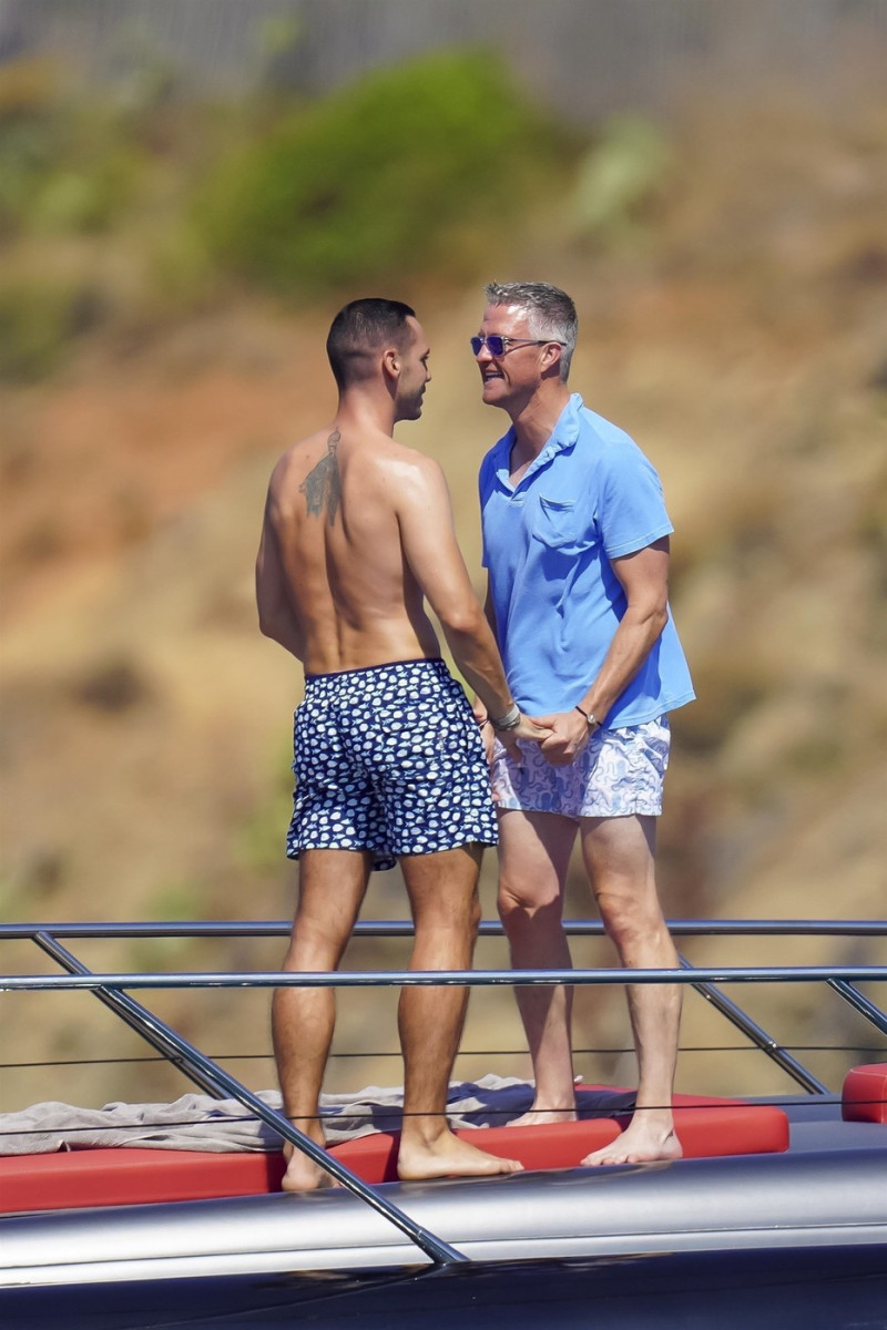 *EXCLUSIVE* *WEB MUST CALL FOR PRICING* German former racing driver Ralf Schumacher and his partner Etienne enjoy a few tender moments aboard a yacht on a day out at sea in St. Tropez