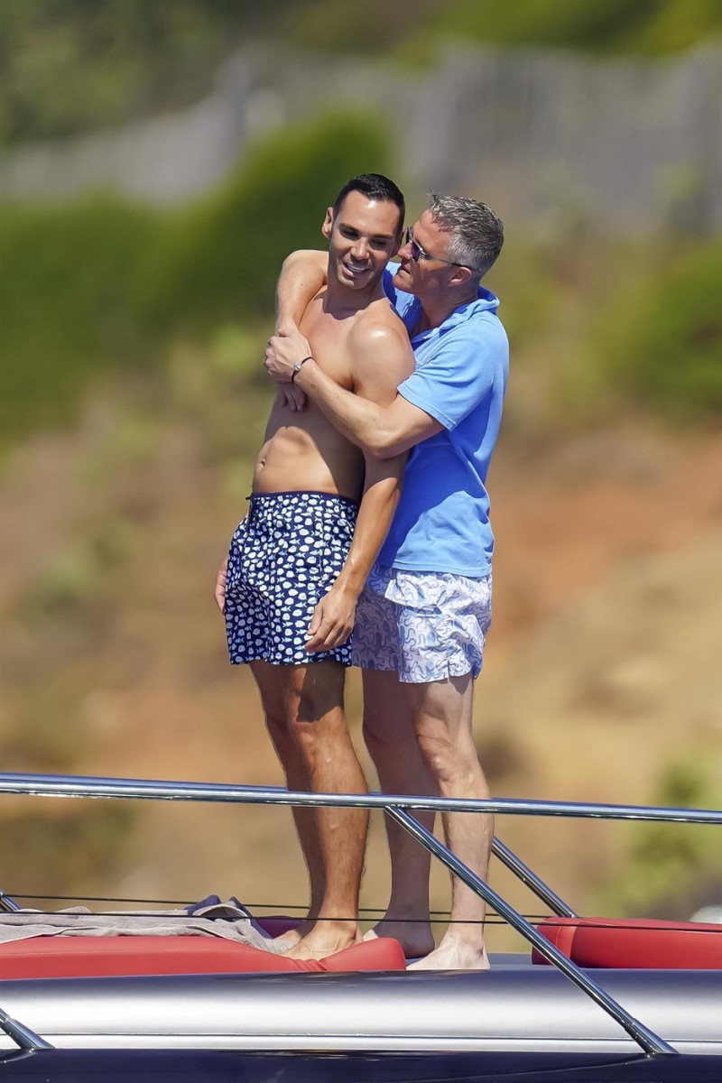 *EXCLUSIVE* *WEB MUST CALL FOR PRICING* German former racing driver Ralf Schumacher and his partner Etienne enjoy a few tender moments aboard a yacht on a day out at sea in St. Tropez