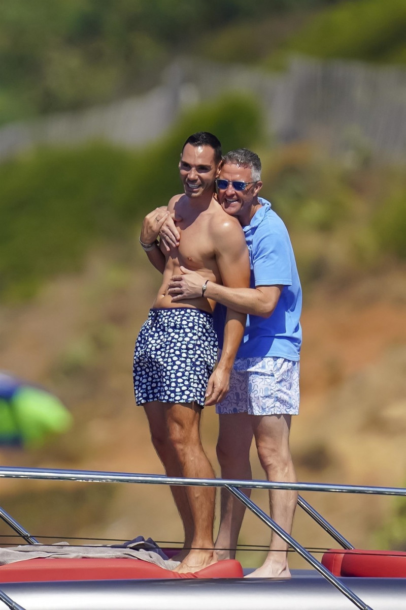 *EXCLUSIVE* *WEB MUST CALL FOR PRICING* German former racing driver Ralf Schumacher and his partner Etienne enjoy a few tender moments aboard a yacht on a day out at sea in St. Tropez