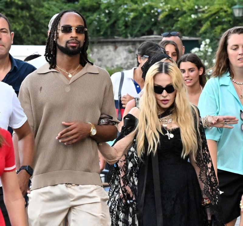 Madonna and her rumoured boyfriend Akeem Morris and a group of friends are pictured out and about in Portofino where they visited a church first before going for dinner at Punny restaurant.Madonna was wearing a D&amp;G outfit.