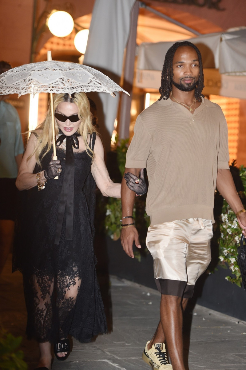 Pop legend Madonna shopping at Dolce &amp; Gabbana with her rumoured new beau 28-year-old Akeem Morris while on holiday in Portofino ahead her 66th birthday celebrations