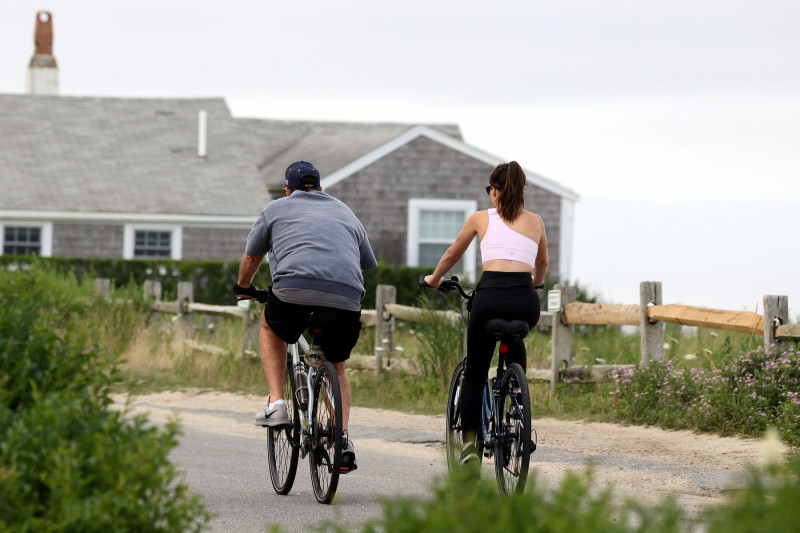 EXCLUSIVE: Bill Belichick and Jordon Hudson go for an early evening bike ride along the bike paths of Nantucket.