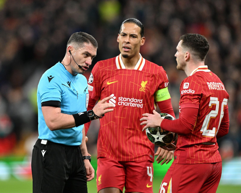 Liverpool, England, 11th March 2025. Referee Istvan Kovacs speaks to Andrew Robertson of Liverpool during the UEFA Champions League match Liverpool vs Paris Saint Germain at Anfield, Liverpool. Picture credit should read: Cody Froggatt / Sportimage