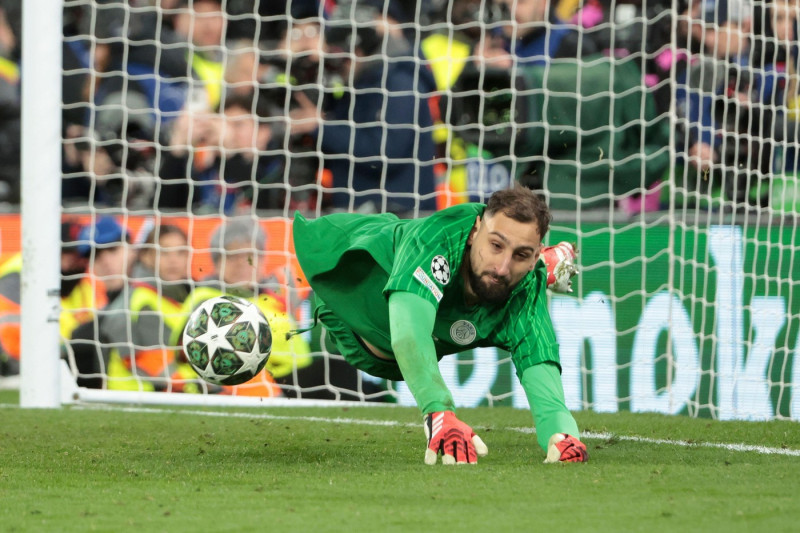 PSG goalkeeper Gianluigi Donnarumma stops a penalty during the penalty shootout of the UEFA Champions League, Round of 16, 2nd leg football match between Liverpool FC and Paris Saint-Germain (PSG) on March 11, 2025 at Anfield stadium in Liverpool, England