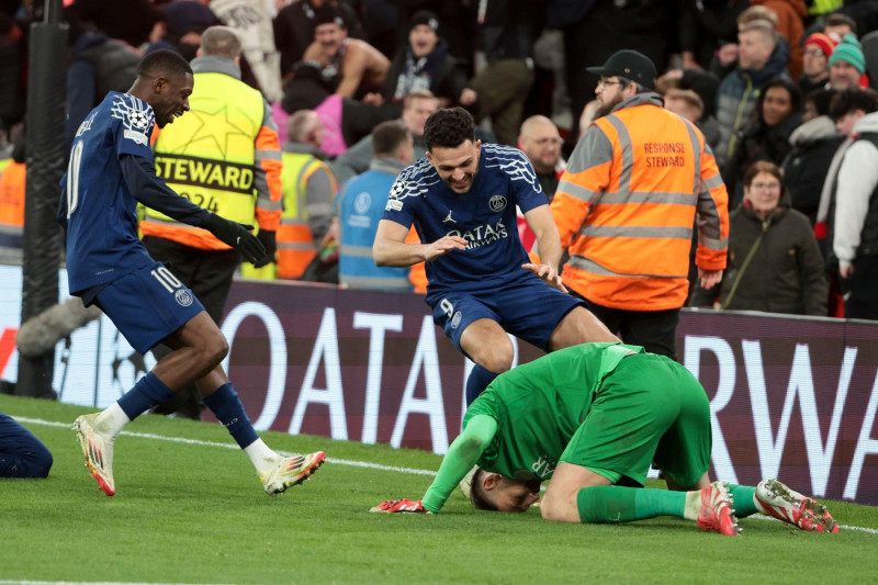 Ousmane Dembele, Goncalo Ramos, PSG goalkeeper Gianluigi Donnarumma celebrate the victory following the penalty shootout of the UEFA Champions League, Round of 16, 2nd leg football match between Liverpool FC and Paris Saint-Germain (PSG) on March 11, 2025