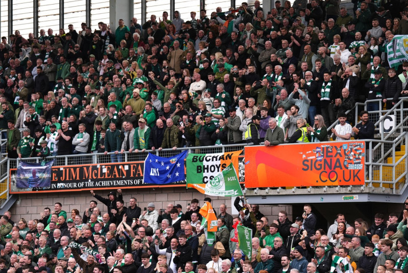Celtic fans in the stands celebrate victory in the William Hill Premiership following the William Hill Premiership match at Tannadice Park, Dundee. Picture date: Saturday April 26, 2025.