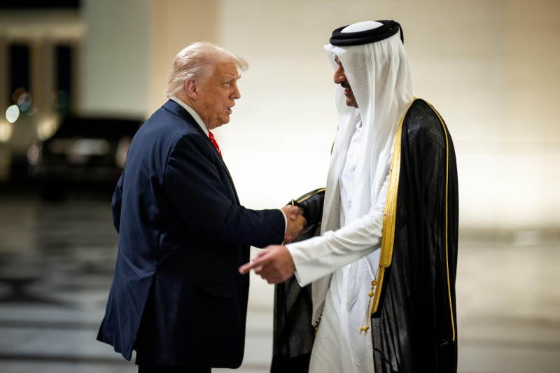 President Donald Trump is greeted by Amir of Qatar Sheikh Tamin bin Hamad Al Thani at Lusail Palace in Doha, Qatar, Wednesday, May 14, 2025, to attend an official State Dinner. (Official White House Photo by Daniel Torok)