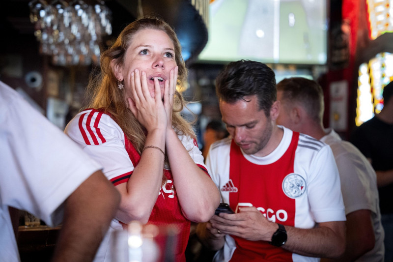 Supporters watch the Eredivisie soccer match Ajax against FC Twente together in the Amsterdam city center, Sunday May 18. With one point difference, the battle for the national title went between PSV and Ajax. ANP JEROEN JUMELET netherlands out - belgium