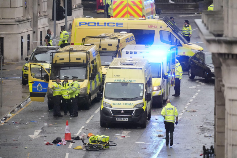 Police and emergency personnel dealing with a road traffic accident on Water Street near the Liver Building in Liverpool after a car collided with pedestrians during the Premier League winners parade. A man has been detained. Picture date: Monday May 26,