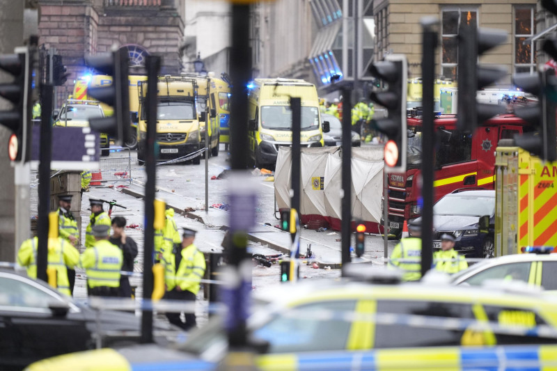 Police and emergency personnel dealing with a road traffic accident on Water Street near the Liver Building in Liverpool after a car collided with pedestrians during the Premier League winners parade. A man has been detained. Picture date: Monday May 26,