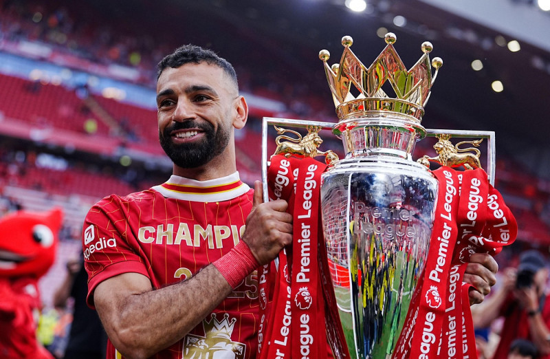Liverpool's Mohamed Salah celebrates with the Premier League trophy after the Premier League match at Anfield, Liverpool. Picture date: Sunday May 25, 2025.