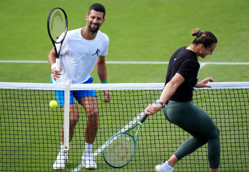 Novak Djokovic and Aryna Sabalenka during a practice session at the All England Lawn Tennis and Croquet Club, ahead of the Wimbledon Championships, which begin on June 30th. Picture date: Wednesday June 25, 2025.