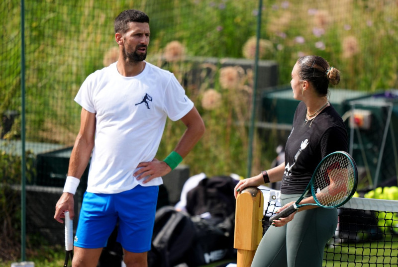 Novak Djokovic and Aryna Sabalenka during a practice session at the All England Lawn Tennis and Croquet Club, ahead of the Wimbledon Championships, which begin on June 30th. Picture date: Wednesday June 25, 2025.