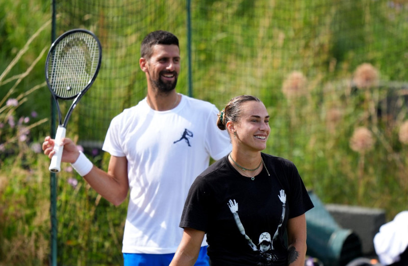 Novak Djokovic and Aryna Sabalenka during a practice session at the All England Lawn Tennis and Croquet Club, ahead of the Wimbledon Championships, which begin on June 30th. Picture date: Wednesday June 25, 2025.