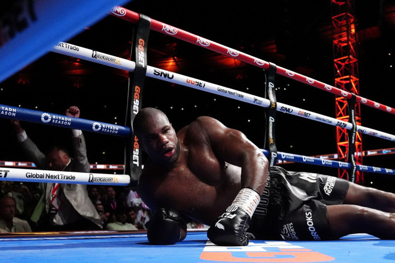 Daniel Dubois is knocked down by Oleksandr Usyk during their IBF, IBO, WBC and WBO World heavyweight bout at Wembley Stadium, London. Picture date: Saturday July 19, 2025.