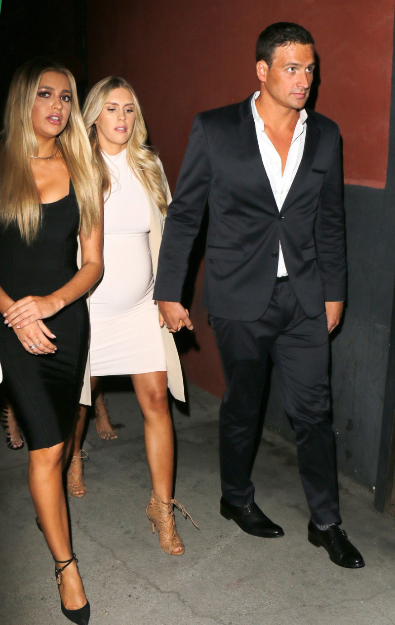 Ryan Lochte and pregnant fiancee Kayla Rae Reid seen kissing while arriving at the Dream Hotel opening of 'TAO' in Hollywood