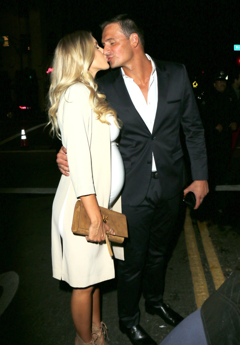 Ryan Lochte and pregnant fiancee Kayla Rae Reid seen kissing while arriving at the Dream Hotel opening of 'TAO' in Hollywood