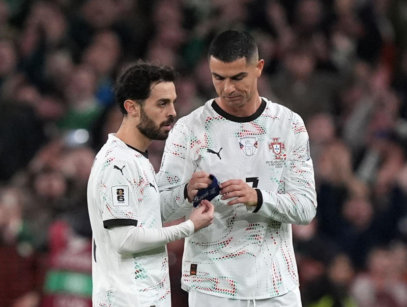 Portugal's Cristiano Ronaldo hands the arm band to team-mate Bernardo Silva after being shown a red card during the 2026 FIFA World Cup European Qualifying, Group F match at the Aviva Stadium in Dublin, Ireland. Picture date: Thursday November 13, 2025.