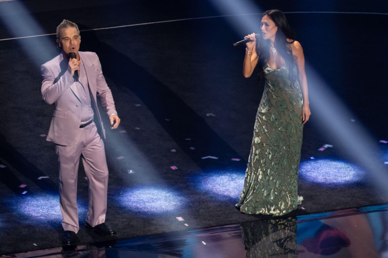 Robbie Williams and Nicole Scherzinger perform on stage during the 2026 FIFA World Cup draw at the John F. Kennedy Center for the Performing Arts in Washington, DC on December 5, 2025