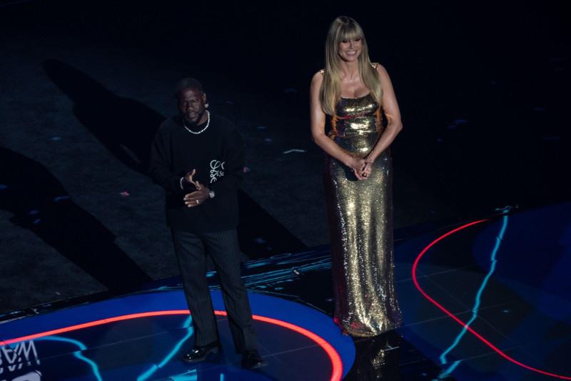 Kevin Hart and Heidi Klum speak on stage during the 2026 FIFA World Cup draw at the John F. Kennedy Center for the Performing Arts in Washington, DC on December 5, 2025